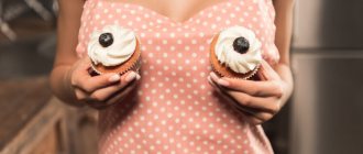 girl holding cupcakes to her chest